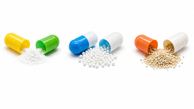Comparison of hard capsule with powder granules and pellets beside the shell